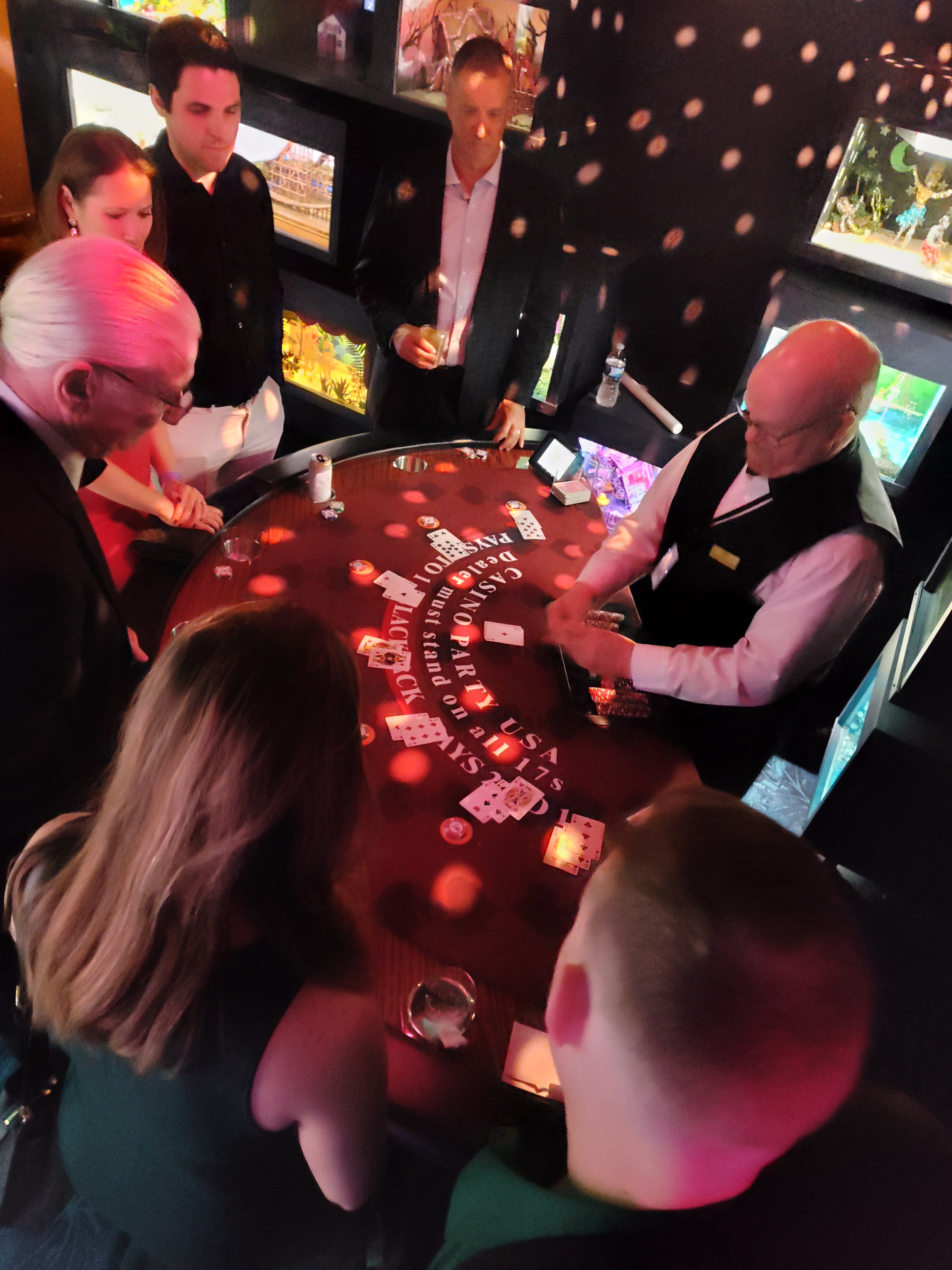 Dealer at a Casino Party USA branded blackjack table in an elegant ballroom in Stevensville