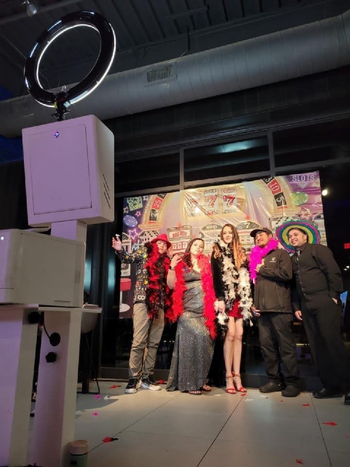 Guests posing at photo booth during Casino Party USA casino event