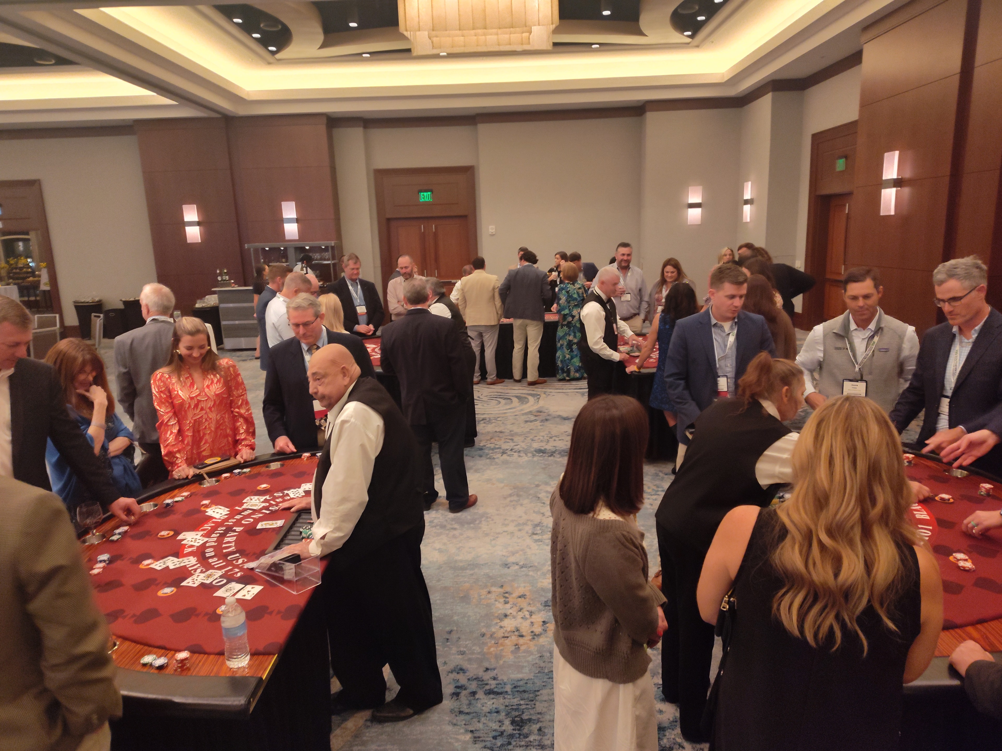 Wide-angle view of a full Casino Party USA event ballroom with multiple tables in Jacksonville
