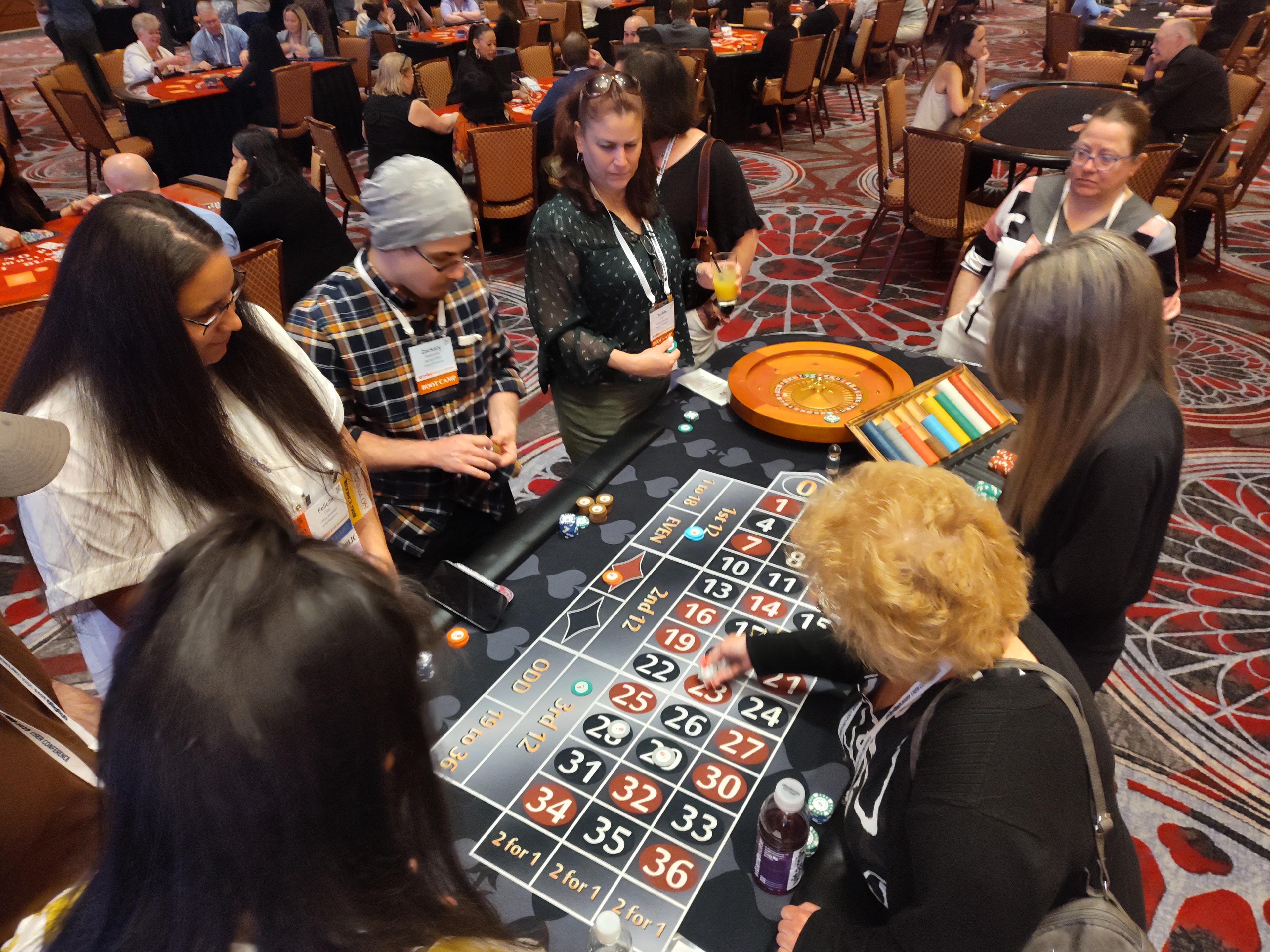 Guests placing bets at a Casino Party USA roulette table at a Las Vegas event