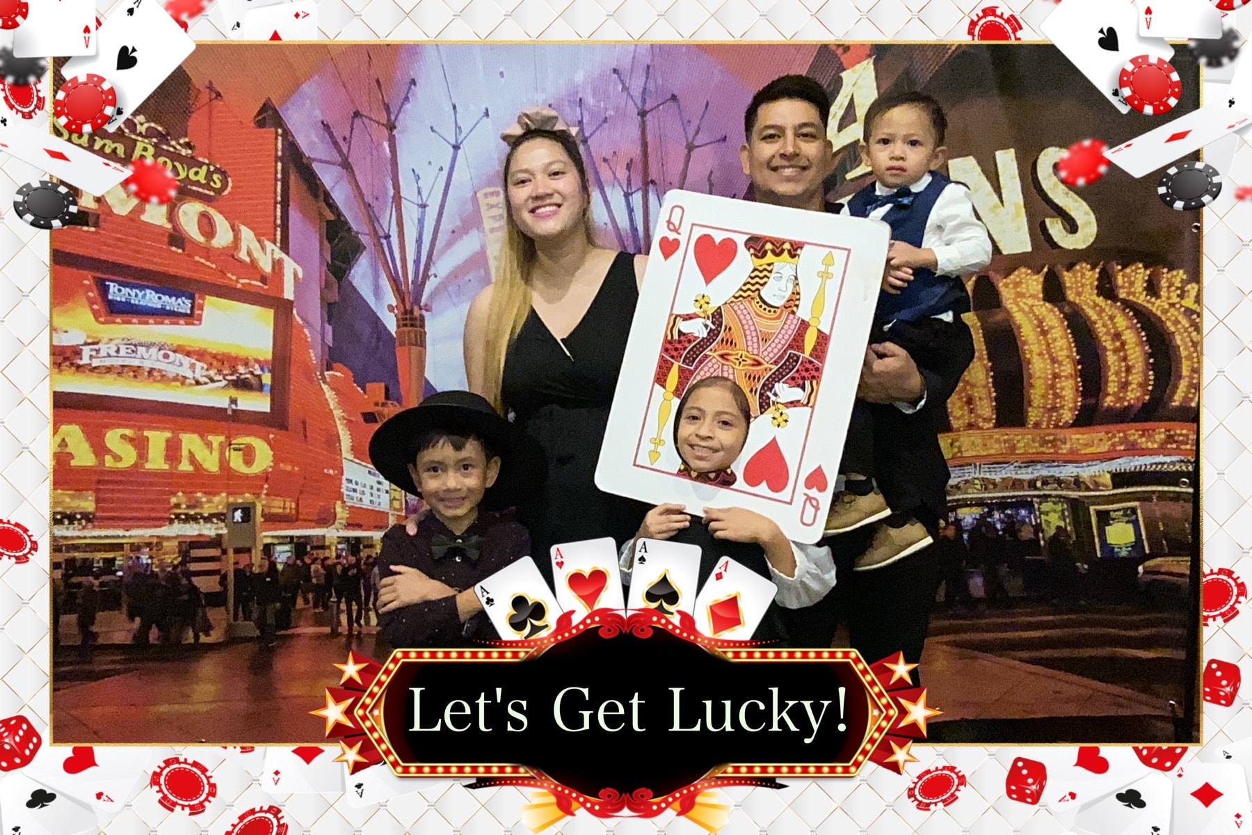 Family photo at Casino Party USA photo booth with Let's Get Lucky frame