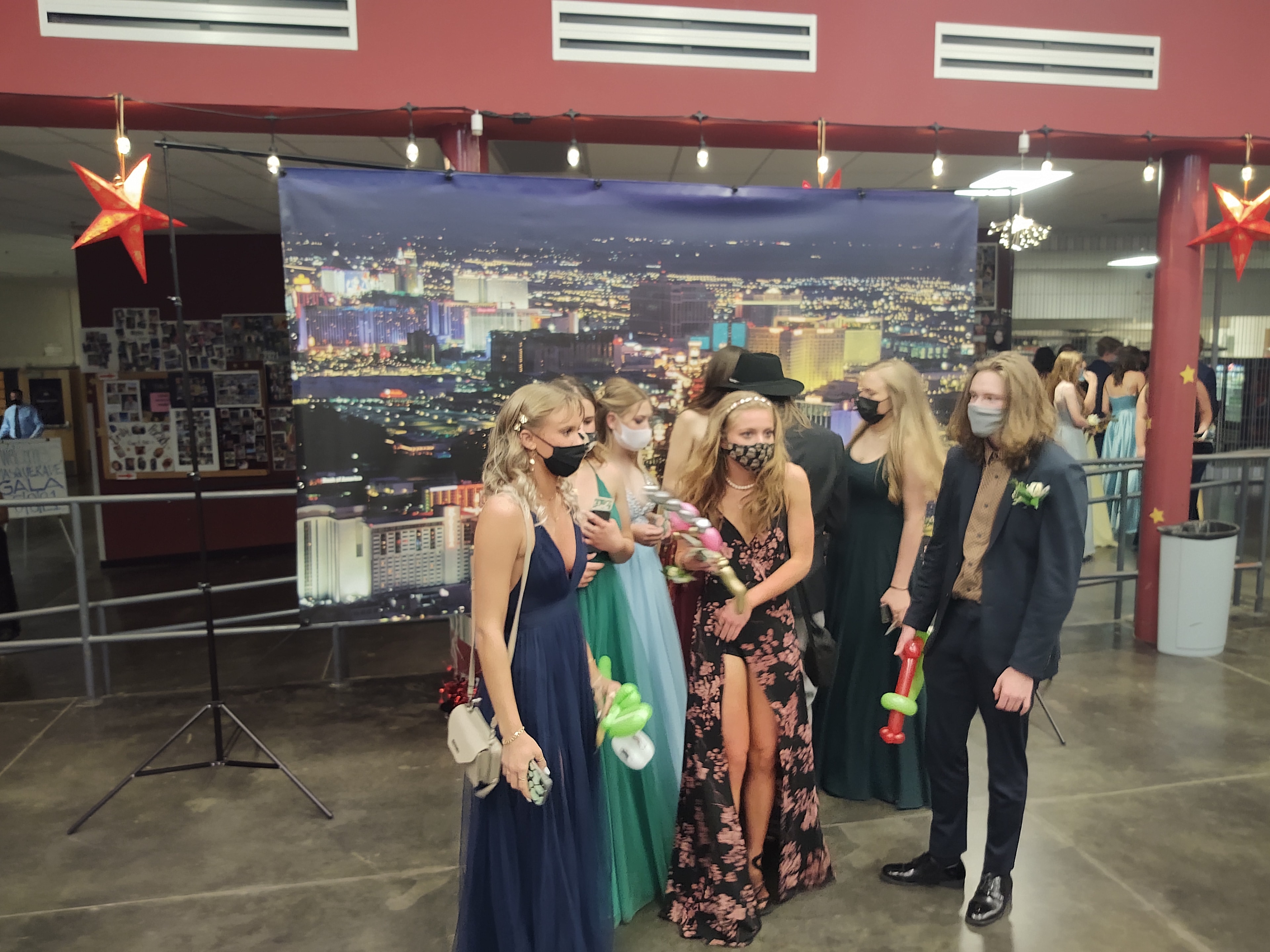 Prom group posing in front of Las Vegas skyline backdrop at Casino Party USA selfie station